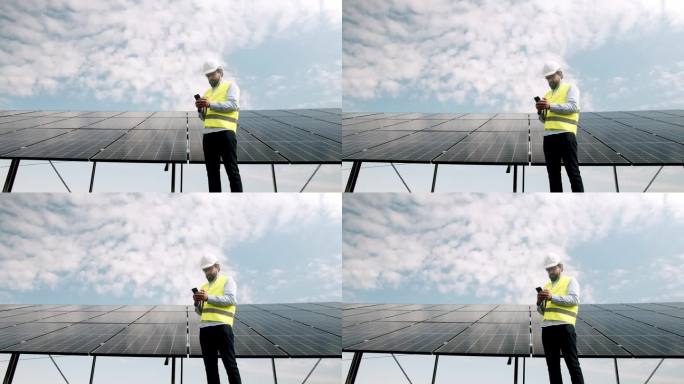 工程师用手机监控光伏太阳能电池板系统
