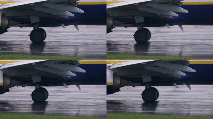 暴雨中在跑道上行驶的飞机的特写镜头。慢动作视频飞机离开机场准备起飞。乘飞机旅行