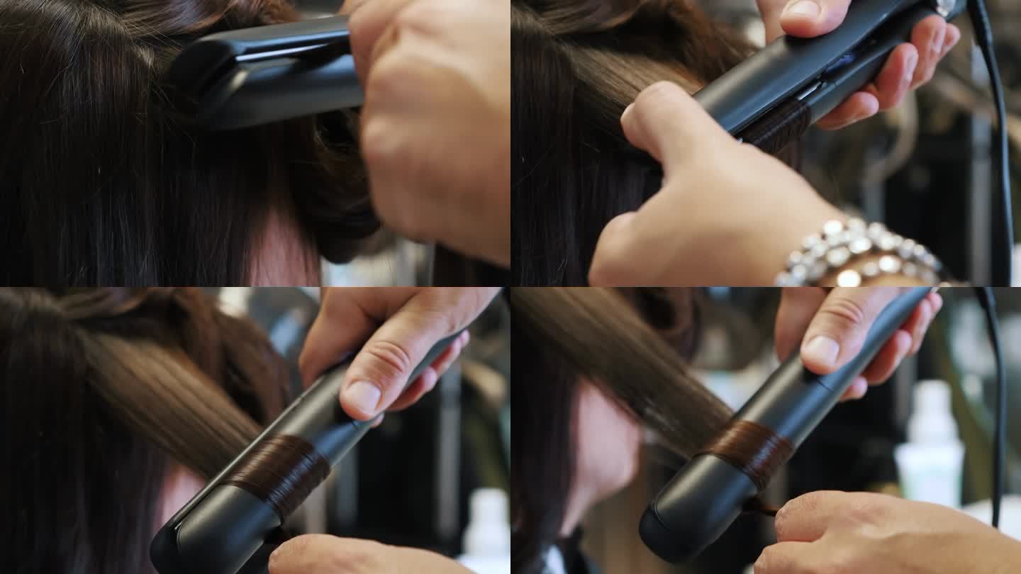 发型师用电卷发棒给女孩做头发。女人卷发，造型。为假期做准备。在豪华美容院，女理发师正在用卷发棒处理一