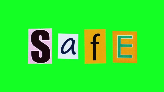 “安全”这个词是由矩形贴纸组成的，在定格动作中折叠和打开