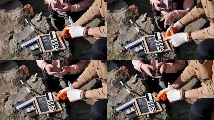 科学家在考古中发现一块古代陶瓷餐具碎片;考古学家用仪器测量参数，用智能手机拍照。