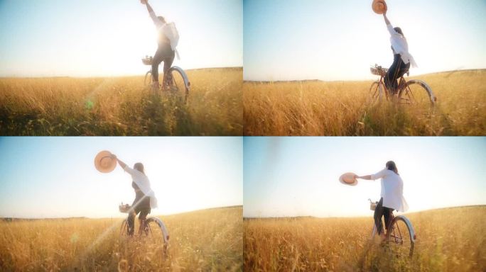 在阳光普照的草地上快乐地骑自行车的女人