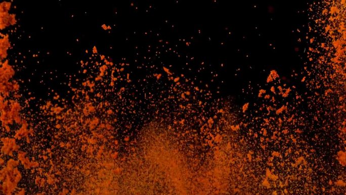 在黑色背景下以1000帧/秒的速度拍摄干红辣椒粉爆炸的超级慢动作。