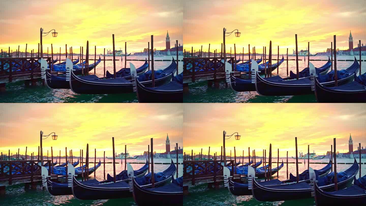 在威尼斯柔和的粉黄色日出中，一艘渡轮穿过摇曳的贡多拉穿过泻湖，一盏灯笼矗立在泻湖蔚蓝的水中