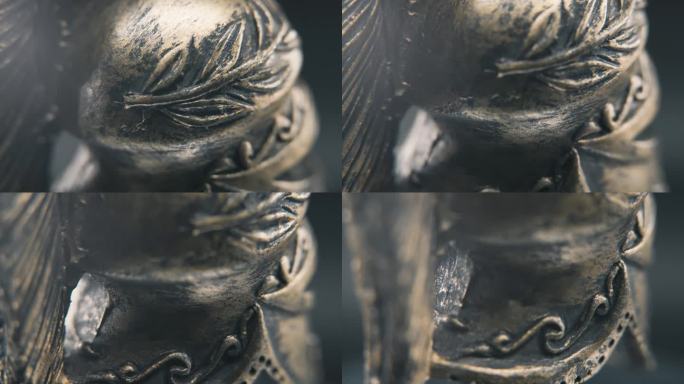 一个动态的近距离微距缓慢倾斜向下拍摄斯巴达人的脸设计，战士古希腊青铜头盔，在一个360旋转的支架上，
