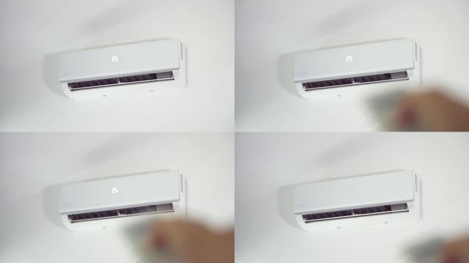 男子在客厅里用遥控器关掉墙上的白色空调。引起普通感冒疾病和流感疾病