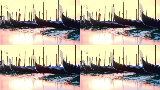视频与波浪的声音从贡多拉和铃声与摇曳的贡多拉和提灯站在蔚蓝的水的泻湖在一个软粉黄色的日出在威尼斯的铃
