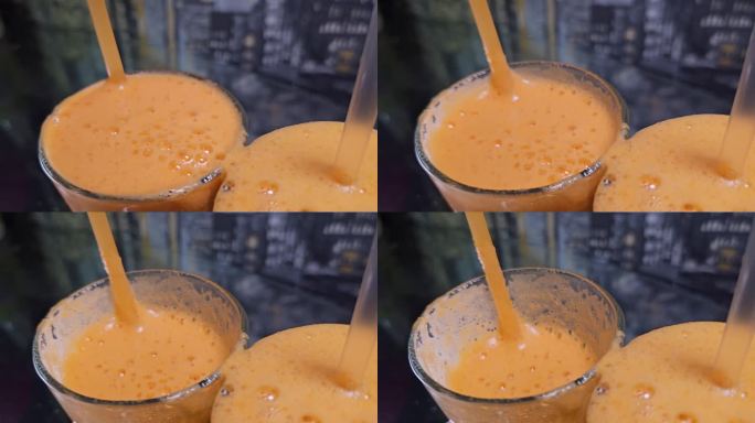 将橙汁、胡萝卜汁、橘子汁、橘子汁、橘子汁、桃子汁、杏汁倒入三个玻璃杯中，放入吸管，喝自制的维他命C，