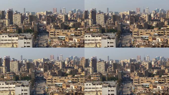 空中静态开罗旧城全景与公寓建筑。车辆行驶在旧街区的街道上。埃及首都交通，交通概念