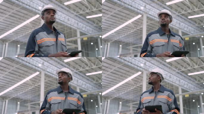 黑人男性品管经理观察纸制品生产车间近景，检查工厂生产机械和产品质量。