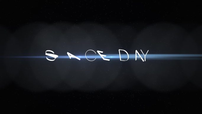 黑色背景上的太空日字体散发出蓝光