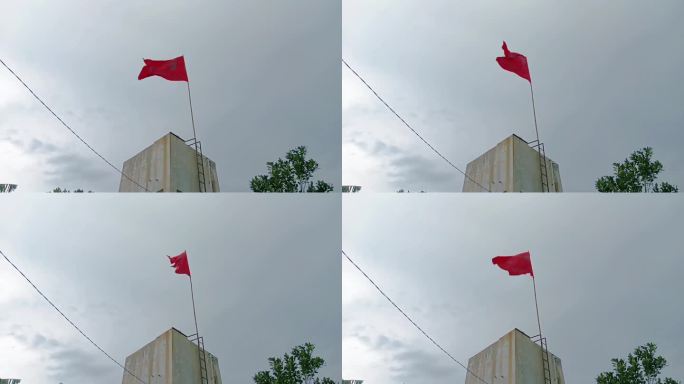 红旗高高飘扬在天空中。