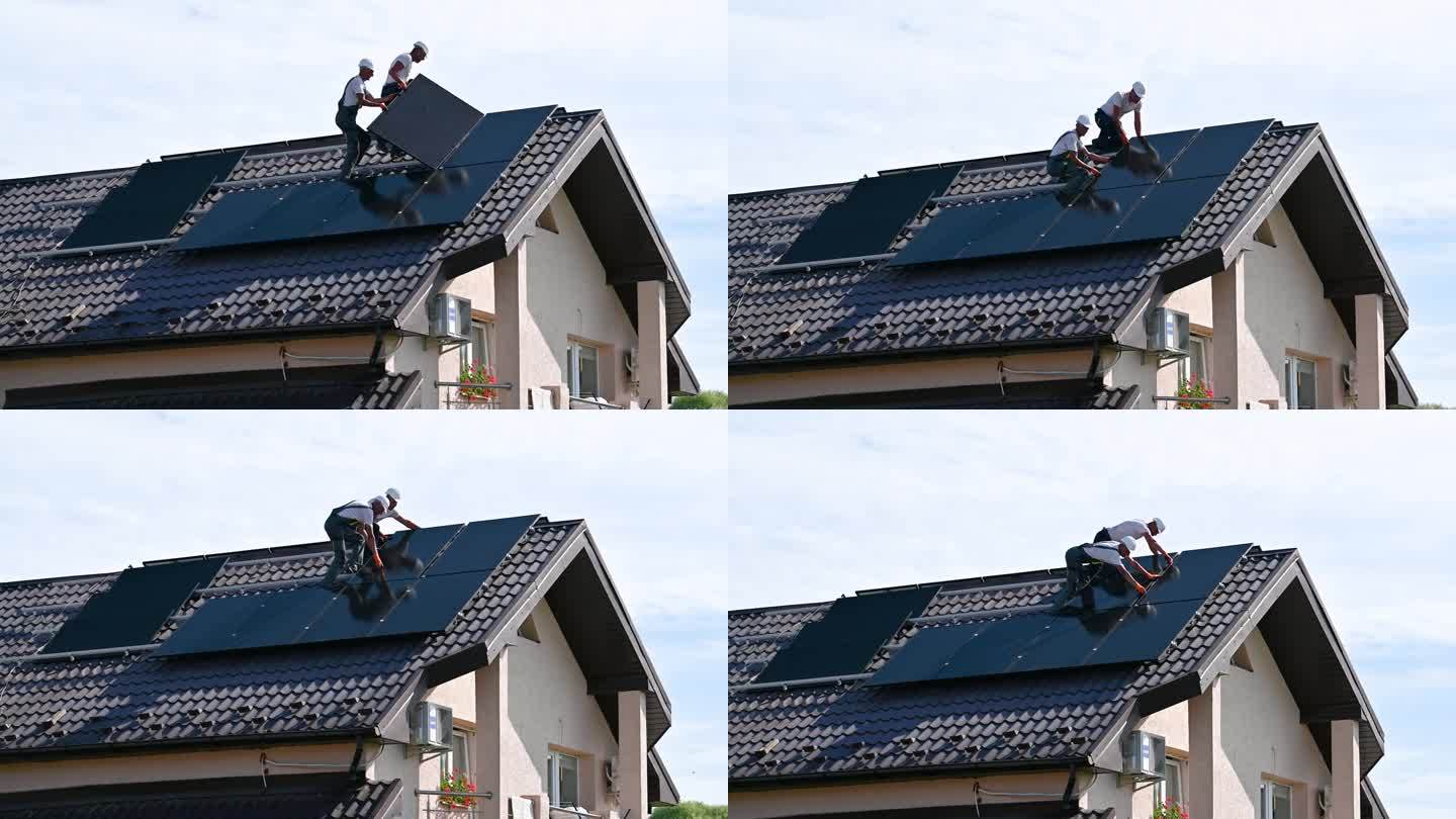 工人们在屋顶上建造太阳能电池板系统。安装光伏太阳能组件的工人