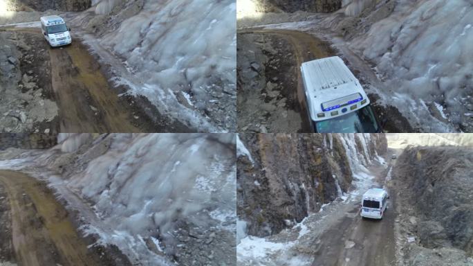 救护车行驶在高原大山冰川航拍