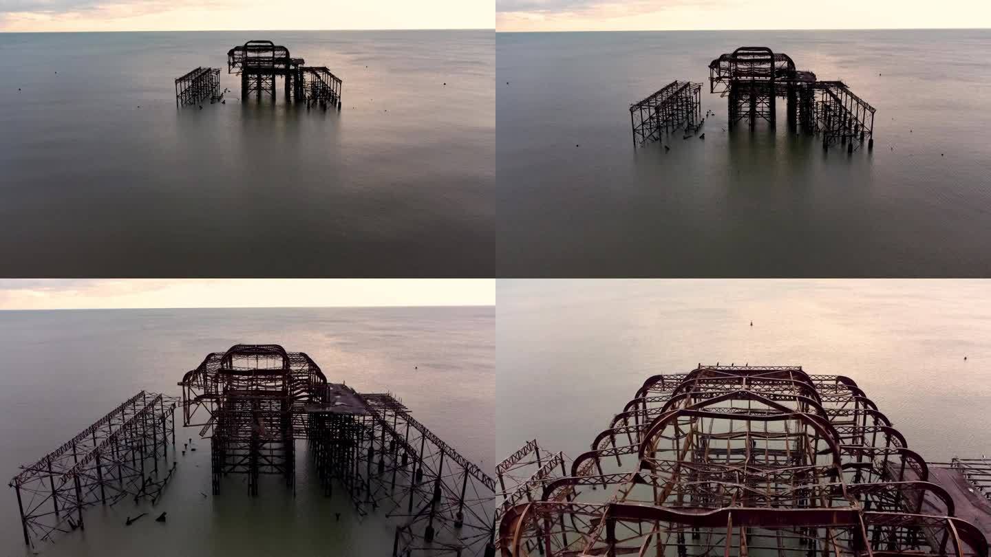 英国布莱顿废弃的西码头。废弃的码头就坐落在受欢迎的海滩旁边。在这里，你可以看到，随着相机的接近和倾斜