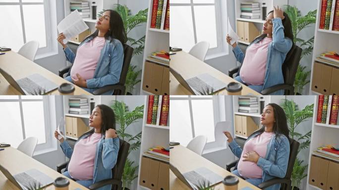 一位年轻的怀孕女商人，为了对抗炎热的办公室带来的不适，在埋头于高要求的工作时，把文件当成了一把扇子。