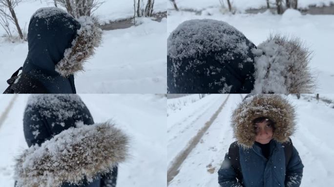 快乐的小男孩在上学的路上玩雪