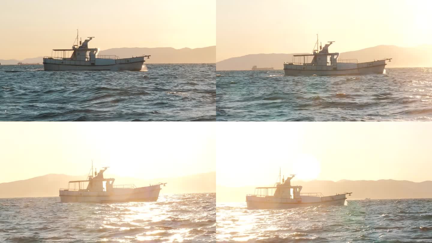 日落时分，海上的白色私人游艇