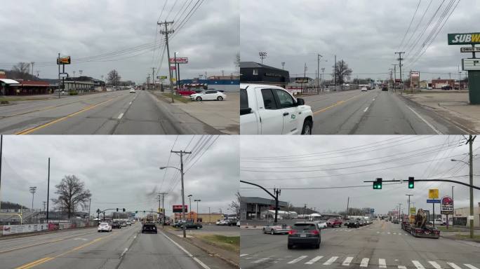 汽车视图拍摄行驶在圣奥尔本斯的主要道路，WV过去的地方和特许经营企业在一个阴天