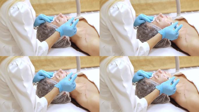美容师双手戴着手套，给女性皮肤注射面部衰老、生物活化、美容