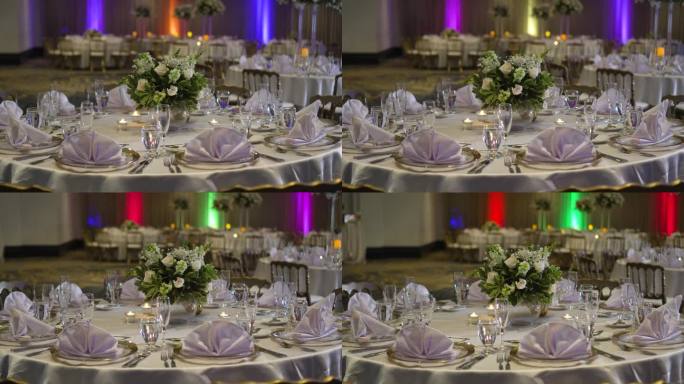 为婚礼庆典而装饰的圆桌。优雅的中心装饰，配以龙葵花和白玫瑰