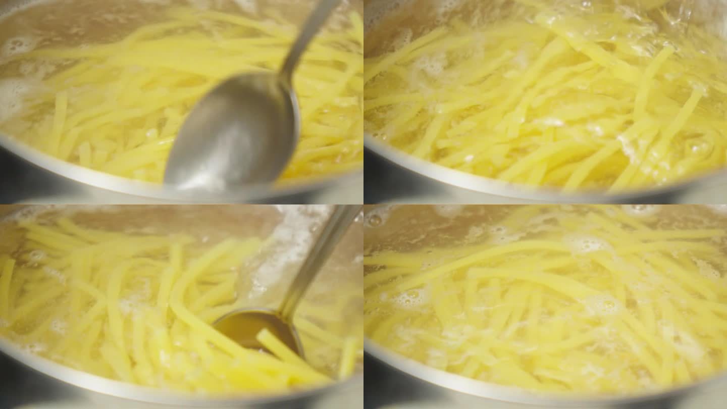 烹饪意大利面。意大利面是用钳子从锅里捞出来的。特写镜头。