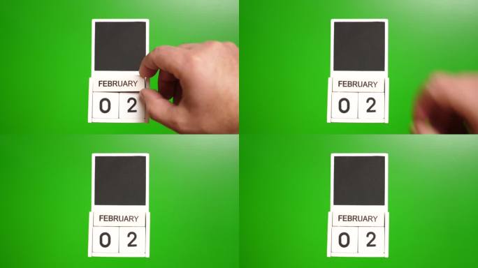 日历上的日期2月2日在一个绿色的背景。说明某一特定日期的事件。