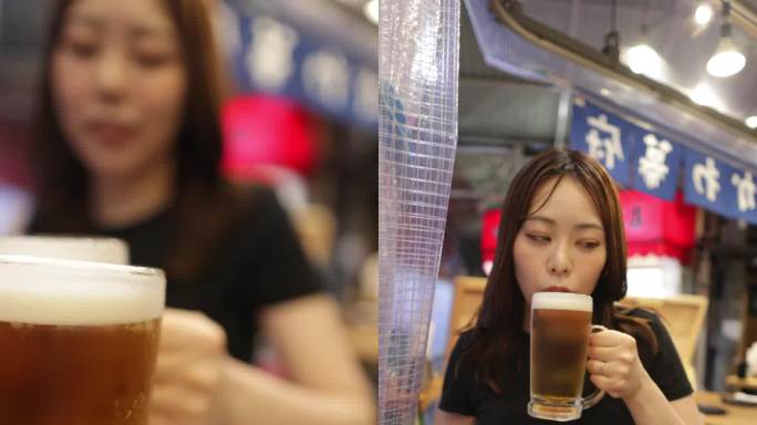 下班后在日本居酒屋酒吧喝啤酒的女人