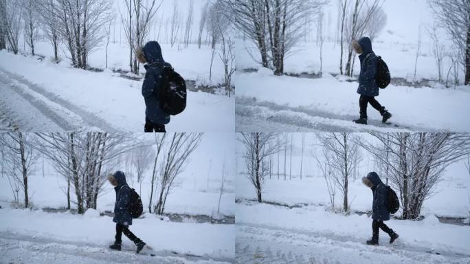 快乐的小男孩在上学的路上玩雪