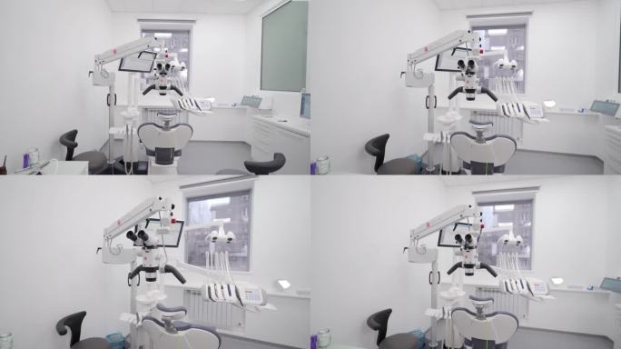 现代化牙科诊所的专业设备。口腔科办公室的旋转双筒牙显微镜。使用牙科显微镜治疗牙齿。牙齿显微外科和修复