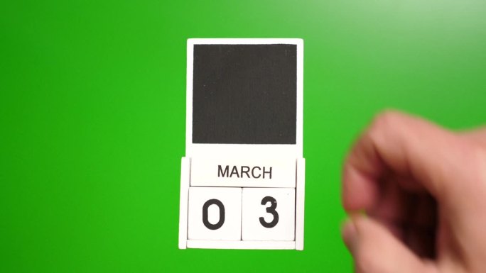 日历上的日期3月3日在绿色的背景。说明某一特定日期的事件。