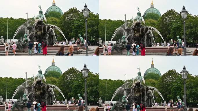 2023年8月10日，德国柏林。亚历山大广场海王星喷泉的慢镜头，人们在散步。倾斜运动。美丽的夏日。