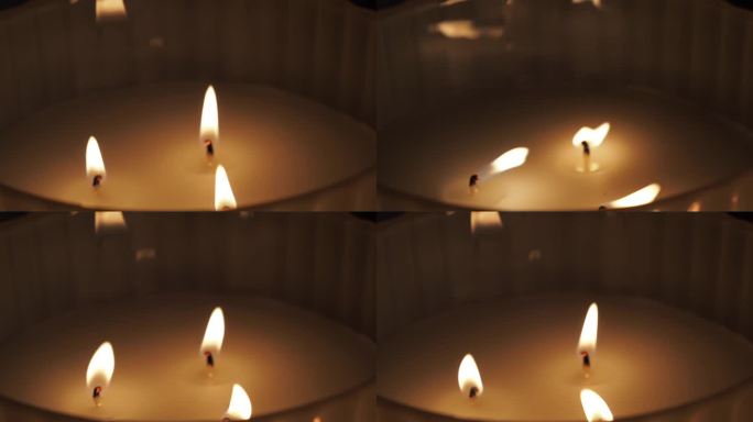 有三个芯的点燃的蜡烛。