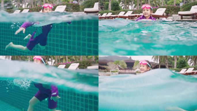 小女孩快乐的在酒店游泳池玩耍戏水
