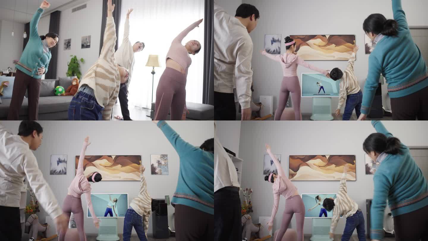 一家人跟着电视做瑜伽锻炼身体