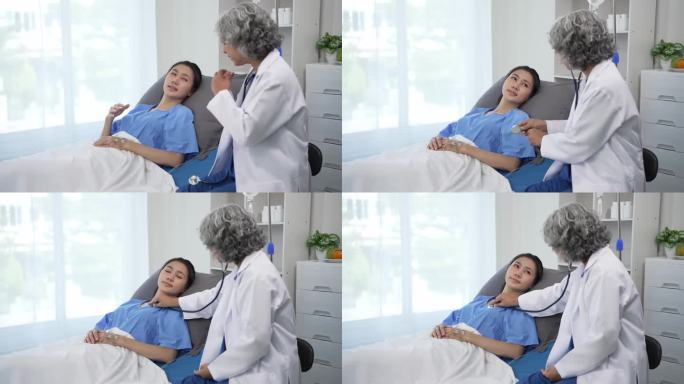 资深亚洲女医生在诊所辅导躺在病床上的年轻亚洲女性，在平板电脑4k 60p上讨论检查结果、健康建议或在