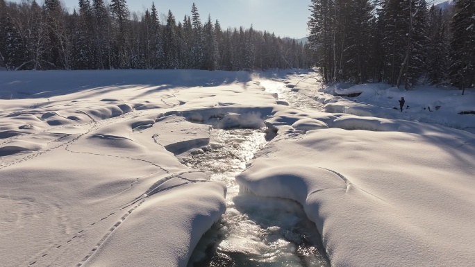 阿勒泰禾木冬季冰雪河流瀑布航拍自然风景