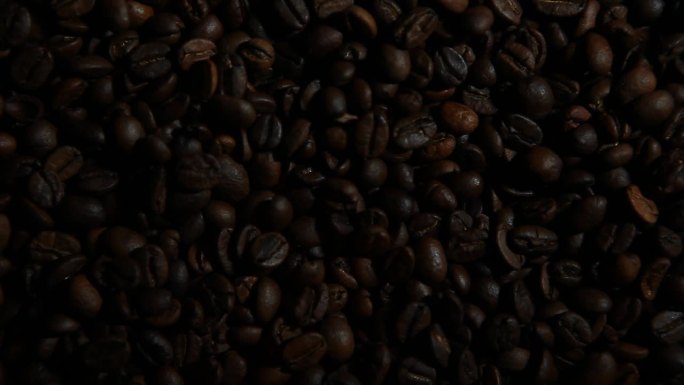 黑咖啡豆背景特写镜头光影变化餐饮行业