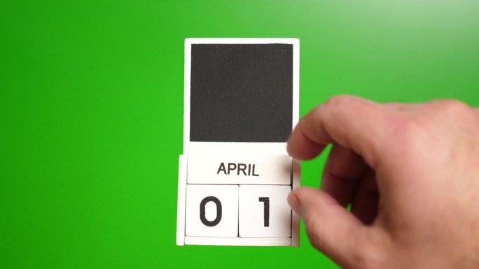日历上的日期4月1日在绿色背景切割。说明某一特定日期的事件。