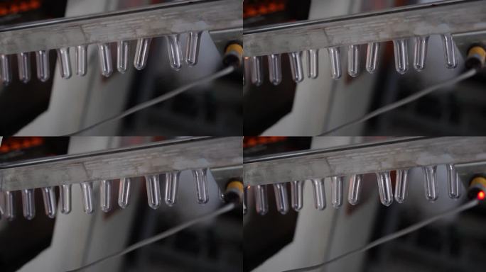 泰国清迈，一家饮用水工厂，小塑料瓶在传送带系统中被热吹成大瓶的视频片段。