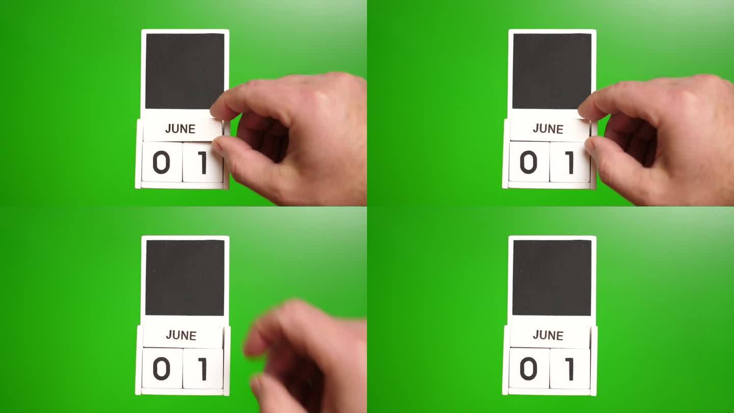 六月一日为绿色背景的日历。说明某一特定日期的事件。