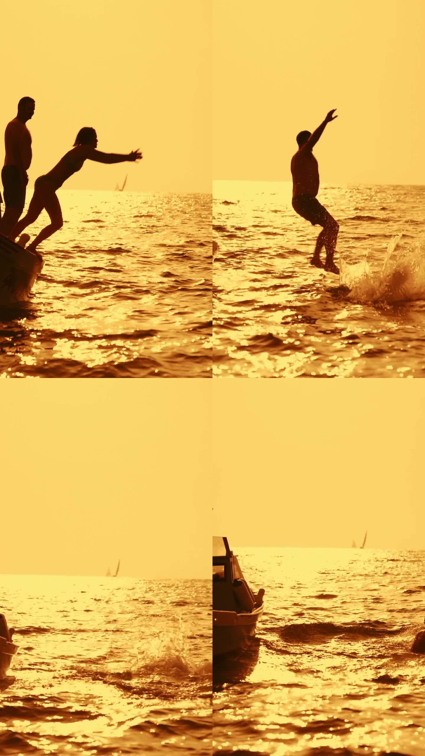 慢镜头，一对无忧无虑的夫妇在日落时分从船上跳入海水