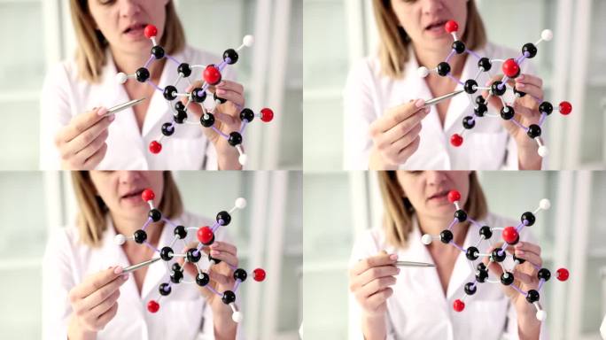 一位女老师展示了一个分子模型，一个特写