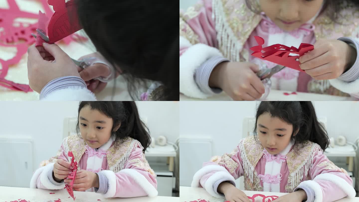 中国小女孩剪纸剪窗花春节过年
