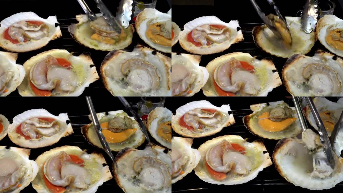 烤新鲜海鲜日本扇贝热在鱼市场的日本街头食品4k