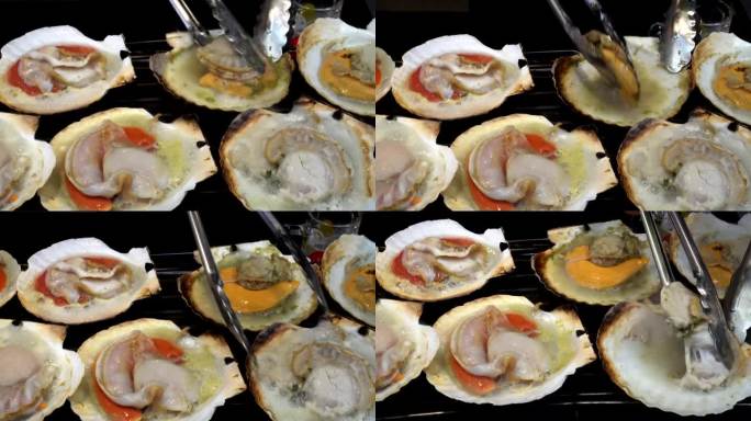 烤新鲜海鲜日本扇贝热在鱼市场的日本街头食品4k