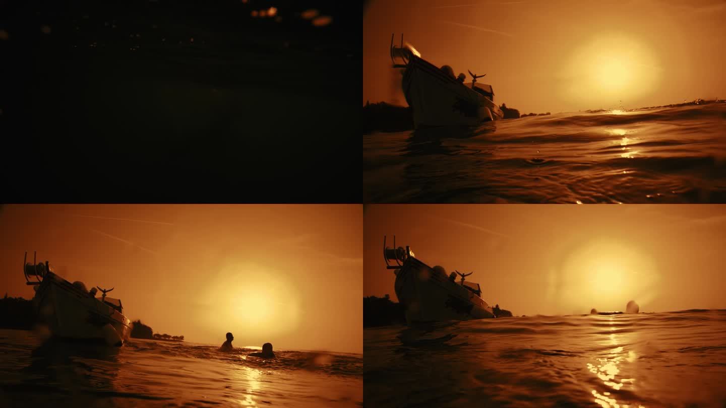 慢动作-时间扭曲效果/速度斜坡剪影夫妇一起跳从船上到海水在日落
