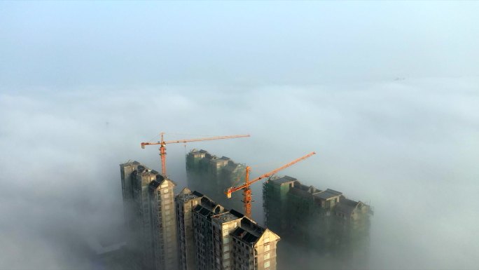 航拍云海中正在建设的楼群