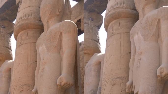 卢克索神庙内的法老雕像和埃及圆柱上的图画