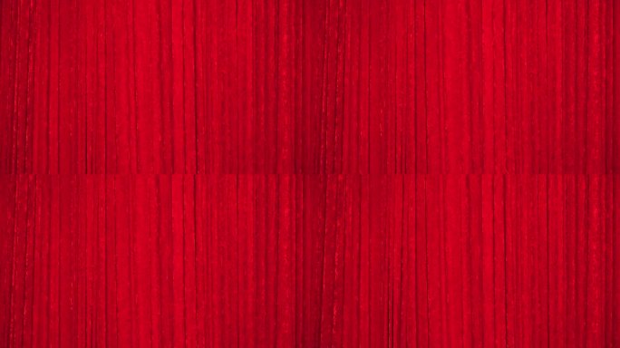 用红色长毛绒织物制成的覆盖舞台的幕布。织物颜色呈红色，布料有质感，纺织背景